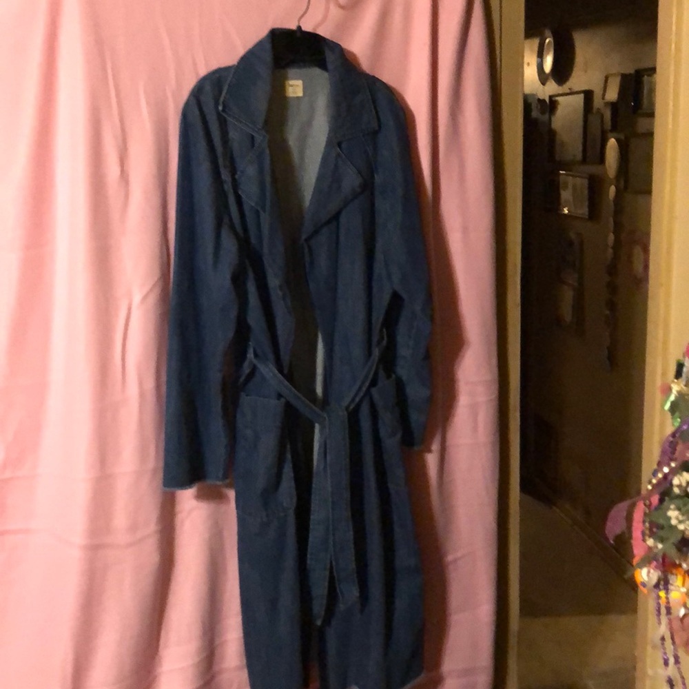 Denim coat midi length.  Has pockets and tie belt
